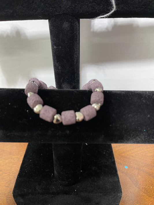 Woman’s bracelet w/ purple lava beads